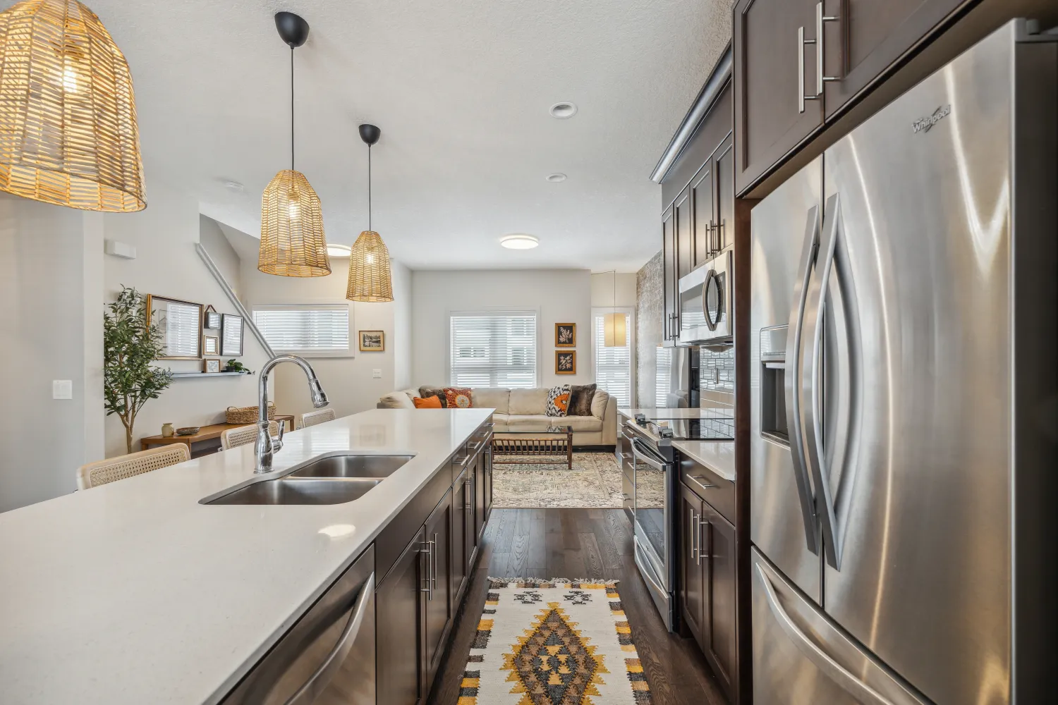 A bright open kitchen looking through to the living room